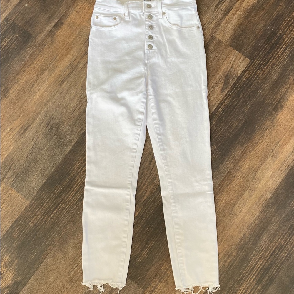 White skinny jeans with button detail
